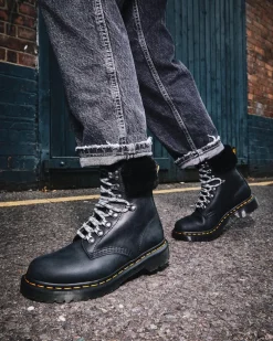 Boots 1460 Serena à Col Doublées de Fourrure Synthétique in Noir